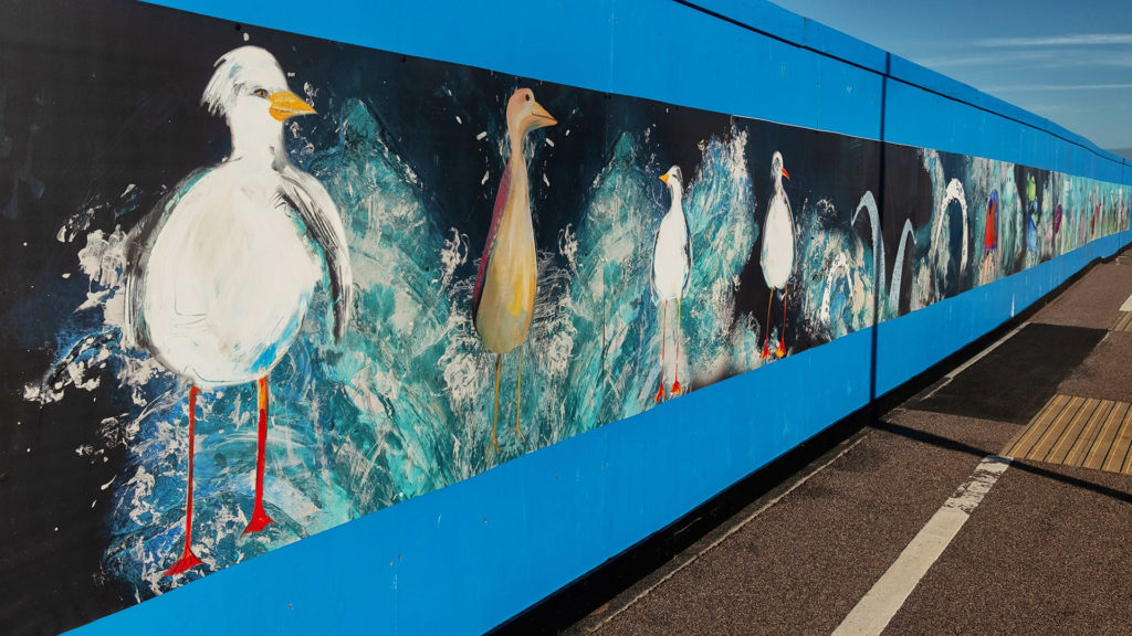 Hoarding designed by local schools is installed at Sideshore